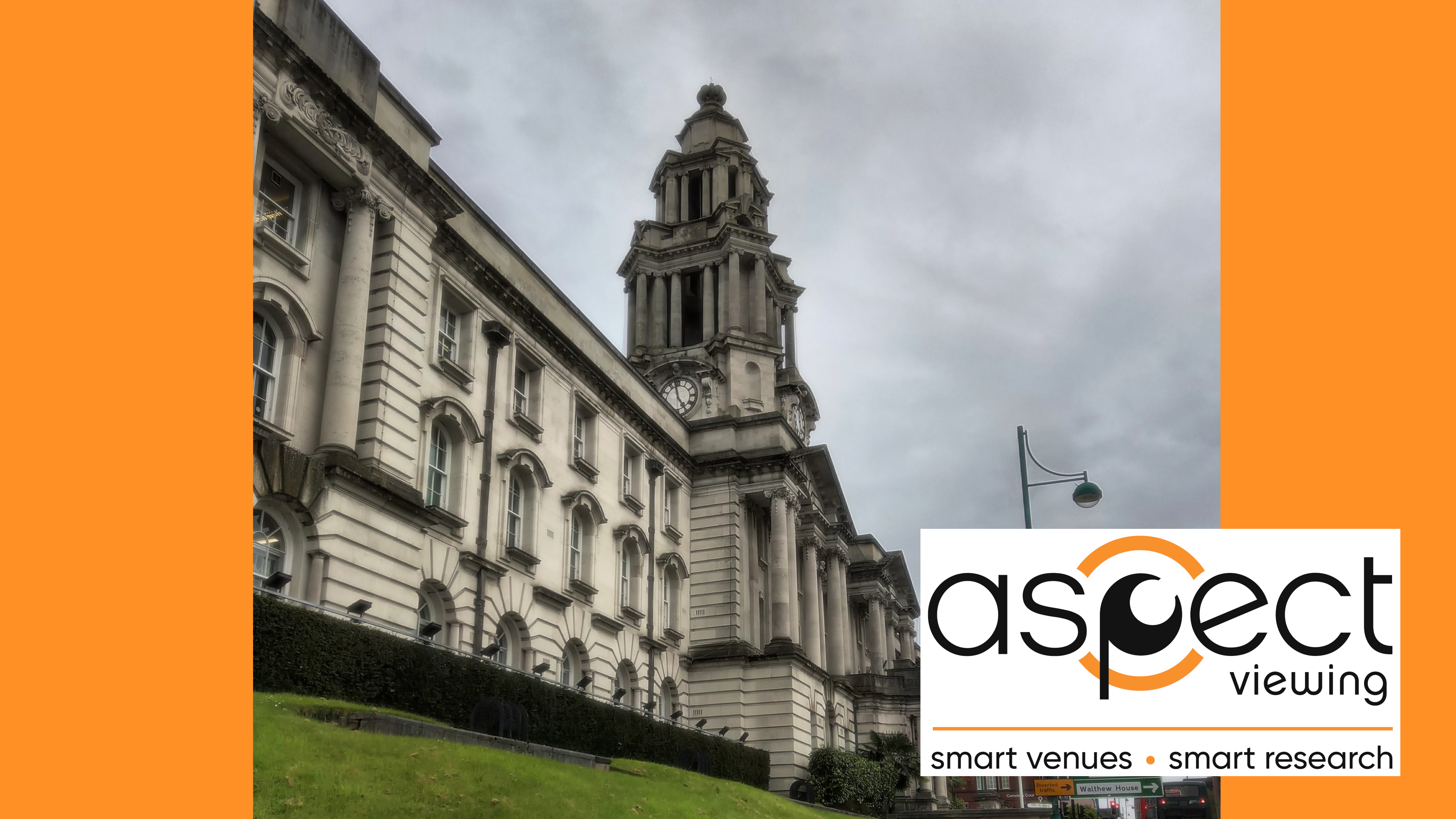 Stockport Town hall from the pavement looking up at a cloudy sky